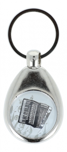Key pendant with metal frame and magnetically held chip