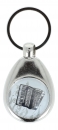 Key pendant with metal frame and magnetically held chip