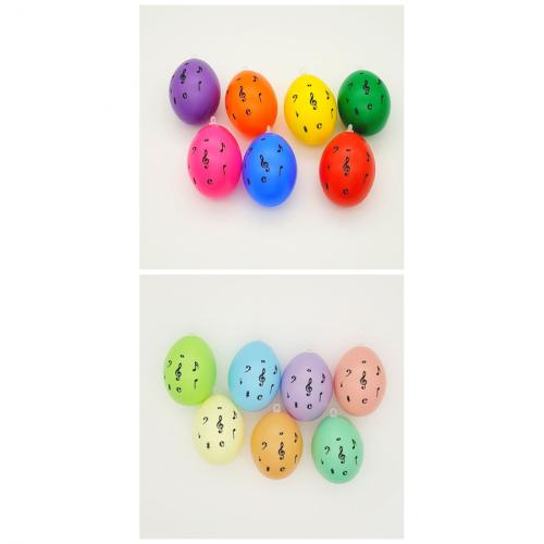 Set of 7 decoration Easter eggs with treble clef and notes, different colors