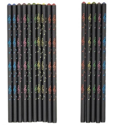 colored pencils with musical notes and decorative gemstone