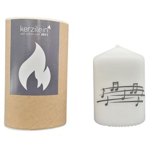 white candle with stave in gift box